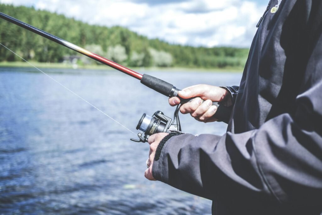 Close-up-fishing Someone holding a fishing rod