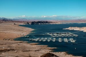 Stunning aerial view of a marina at Lake Mead featuring clear blue water and surrounding desert landscape.